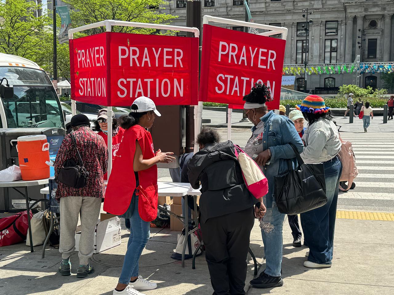 Volunteers welcoming visitors to Prayer Stations in Philadelphia