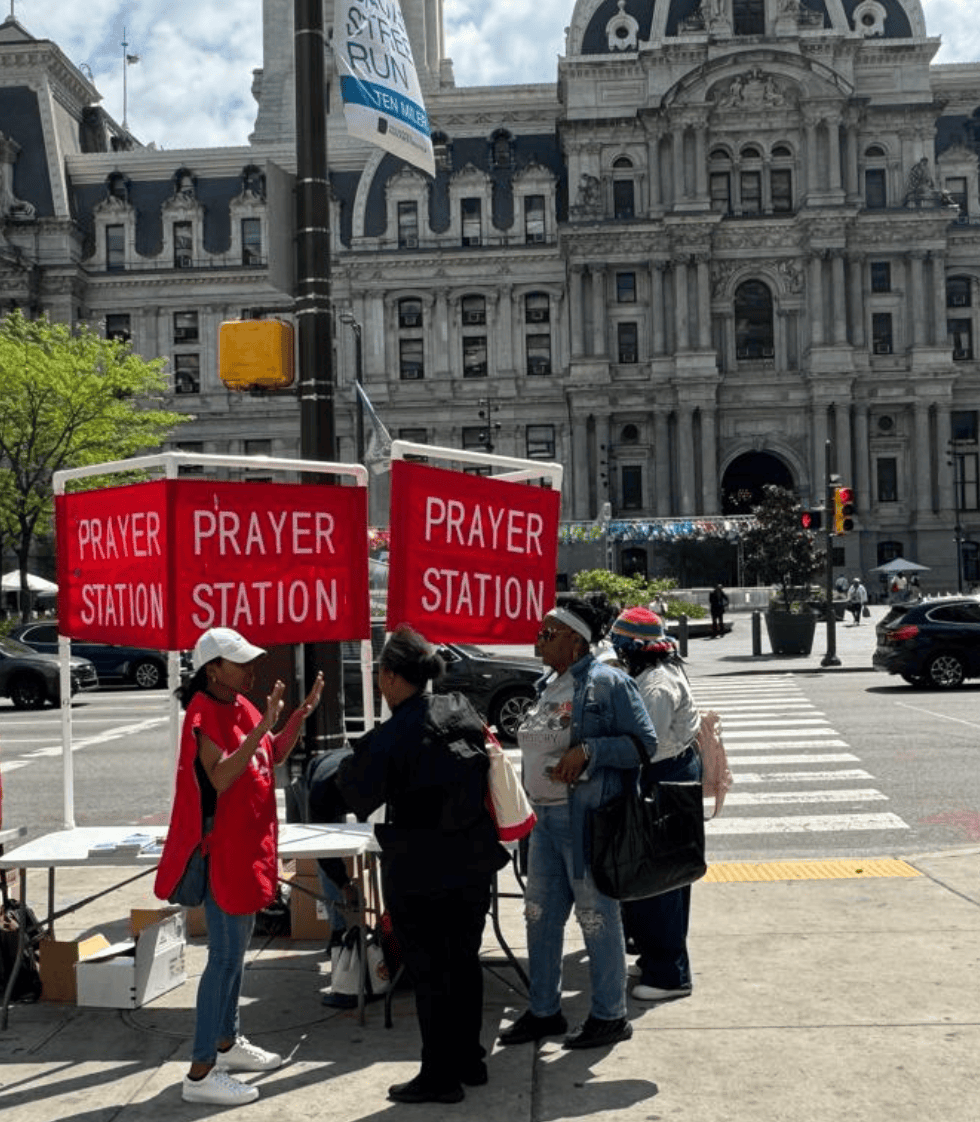 Prayer Station volunteers talking with visitors outside Philadelphia City Hall
